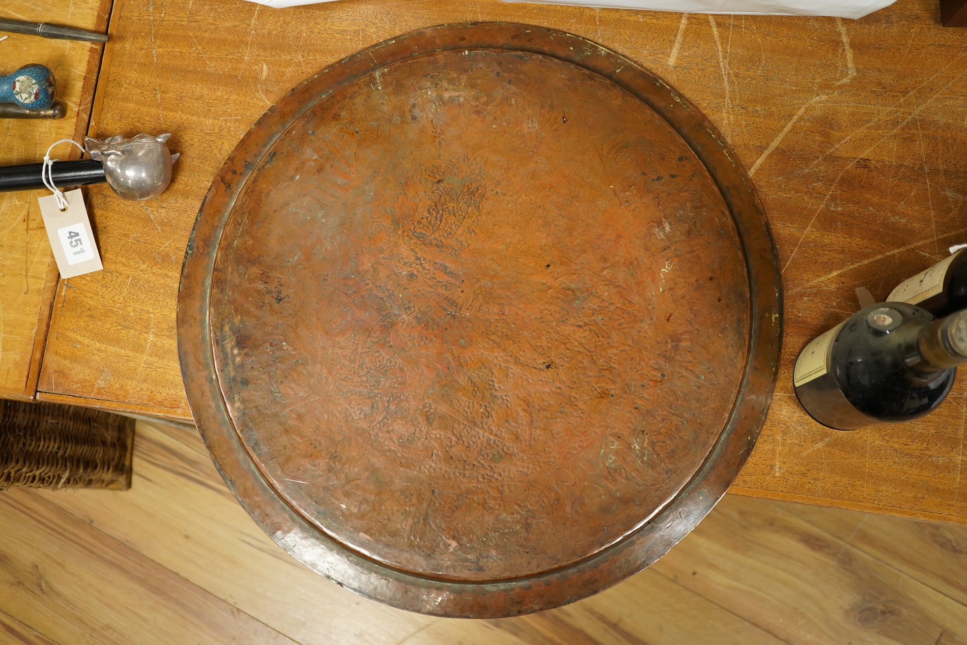 A Middle Eastern circular copper and niello damascened tray, 50cm in diameter. Condition - good